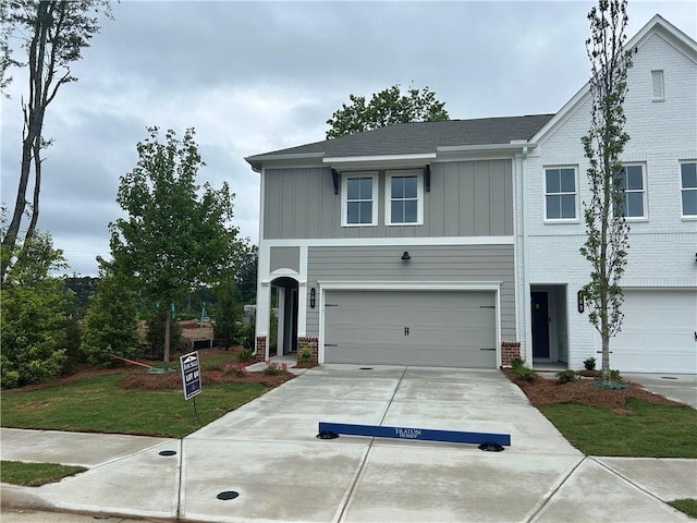 101 Priestwood Ln, Acworth, GA 30102 - view of front of house with brick siding, board and batten siding, driveway, and a garage