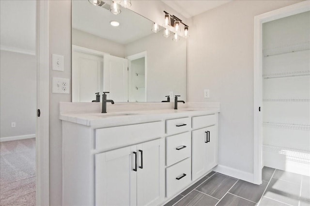 101 Priestwood Ln, Acworth, GA 30102 - bathroom with baseboards, double vanity, and a spacious closet