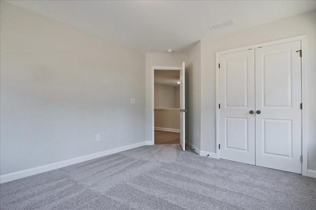 101 Priestwood Ln, Acworth, GA 30102 - unfurnished bedroom featuring carpet flooring, a closet, and baseboards