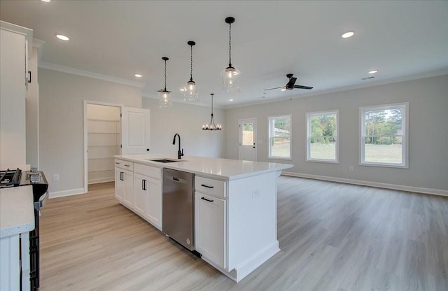 101 Priestwood Ln, Acworth, GA 30102 - kitchen with stainless steel appliances, a sink, ceiling fan, light countertops, and ornamental molding
