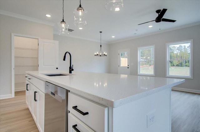 101 Priestwood Ln, Acworth, GA 30102 - kitchen featuring stainless steel dishwasher, a sink, light wood finished floors, pendant lighting, and white cabinets