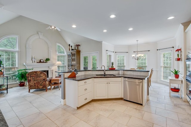 5359 Point S Dr, Gainesville, GA 30504 - kitchen with dishwasher, plenty of natural light, dark stone countertops, recessed lighting, and a chandelier