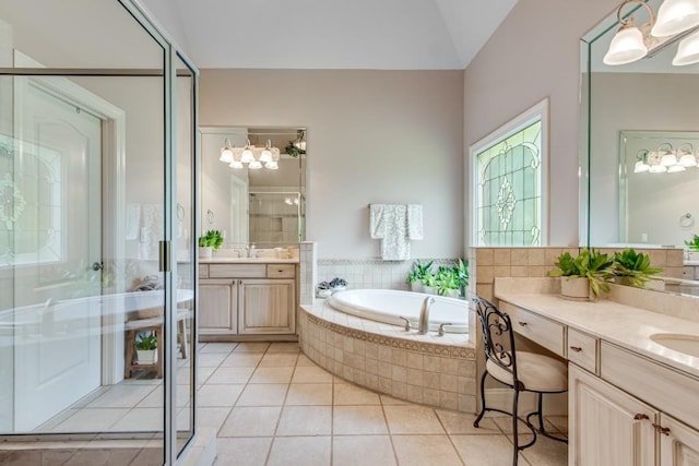 5359 Point S Dr, Gainesville, GA 30504 - full bathroom with a garden tub, a stall shower, two vanities, tile patterned flooring, and lofted ceiling