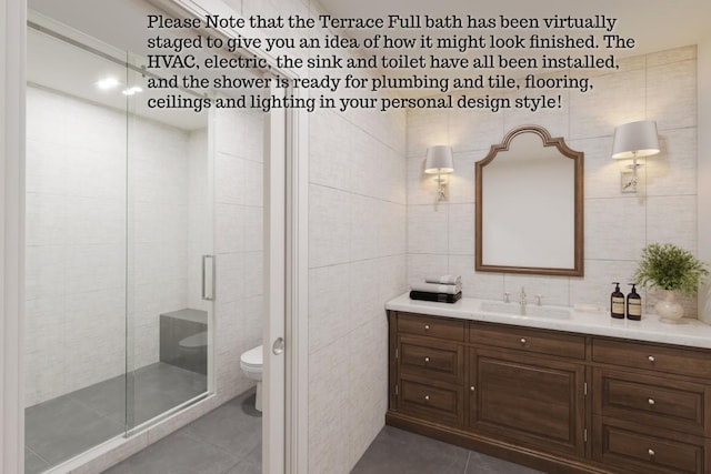 5359 Point S Dr, Gainesville, GA 30504 - full bath featuring tile patterned floors, vanity, tile walls, and a stall shower