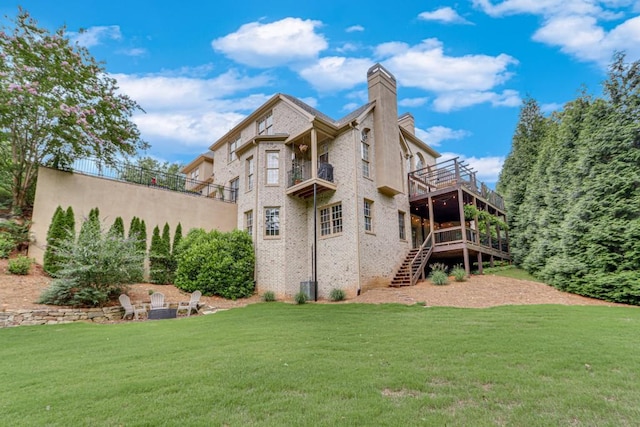 5359 Point S Dr, Gainesville, GA 30504 - back of house featuring a chimney, a yard, stairs, and a wooden deck