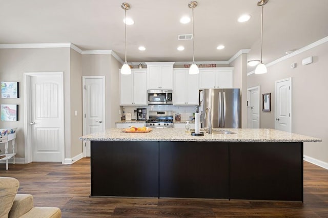 80 Azalea Xing, Dallas, GA 30132 - kitchen with stainless steel appliances, a center island with sink, ornamental molding, white cabinets, and a sink