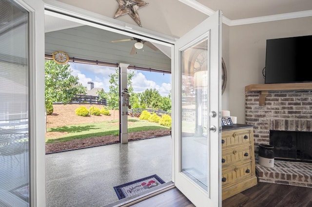 80 Azalea Xing, Dallas, GA 30132 - entryway featuring a brick fireplace, a ceiling fan, crown molding, and dark wood finished floors