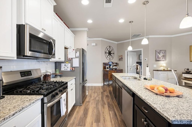 80 Azalea Xing, Dallas, GA 30132 - kitchen featuring appliances with stainless steel finishes, ornamental molding, a sink, wood finished floors, and white cabinetry