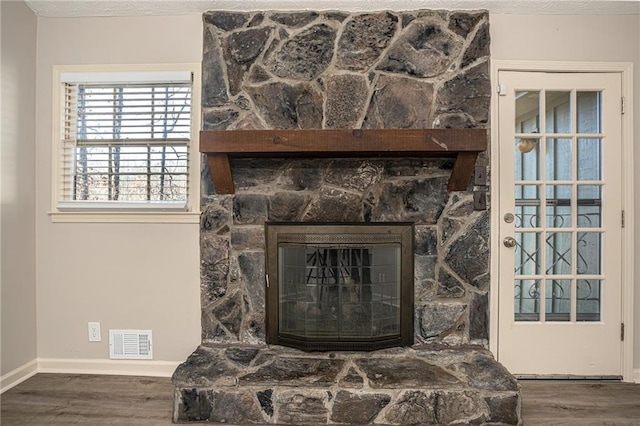 1312 La Mesa Dr, Lawrenceville, GA 30043 - detailed view of wood finished floors, baseboards, and a fireplace