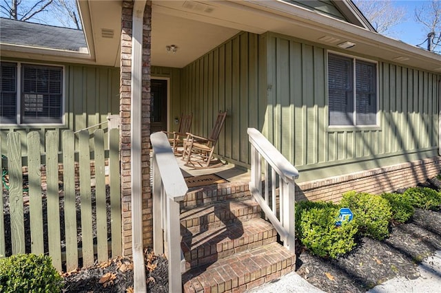 exterior space with a porch and board and batten siding