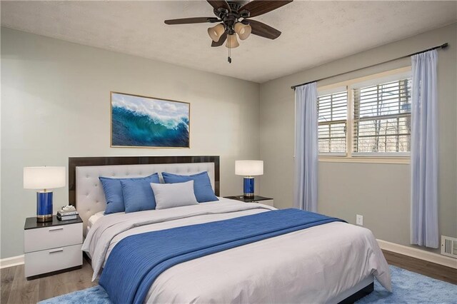 1312 La Mesa Dr, Lawrenceville, GA 30043 - bedroom featuring baseboards, wood finished floors, and ceiling fan