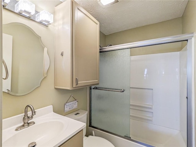 1312 La Mesa Dr, Lawrenceville, GA 30043 - full bath with toilet, combined bath / shower with glass door, vanity, and a textured ceiling