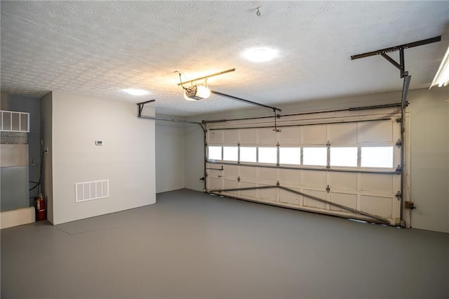1312 La Mesa Dr, Lawrenceville, GA 30043 - garage with a garage door opener