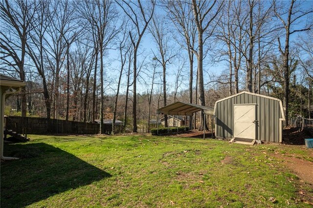 1312 La Mesa Dr, Lawrenceville, GA 30043 - view of yard featuring a shed, an outbuilding, and a detached carport