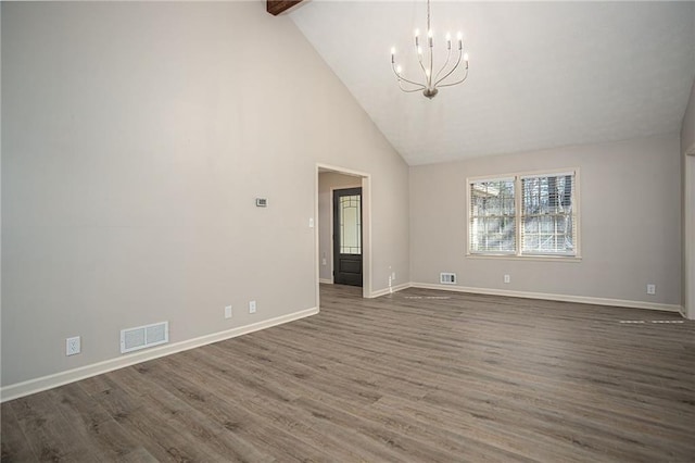 1312 La Mesa Dr, Lawrenceville, GA 30043 - spare room with a chandelier, baseboards, high vaulted ceiling, wood finished floors, and beamed ceiling