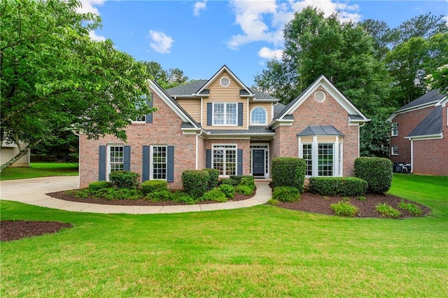1995 Settindown Dr, Roswell, GA 30075 - traditional home with a front lawn and brick siding