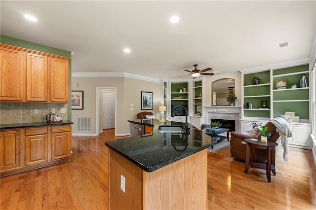 1995 Settindown Dr, Roswell, GA 30075 - kitchen featuring ceiling fan, a fireplace, light wood-style floors, ornamental molding, and dishwasher