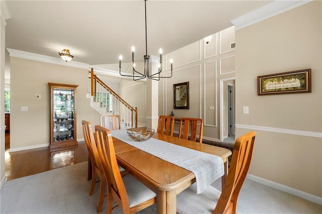 1995 Settindown Dr, Roswell, GA 30075 - dining space with a chandelier, stairs, and crown molding