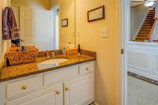 bathroom with ceiling fan and vanity