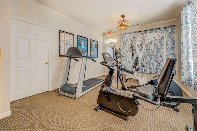 workout room with carpet and baseboards