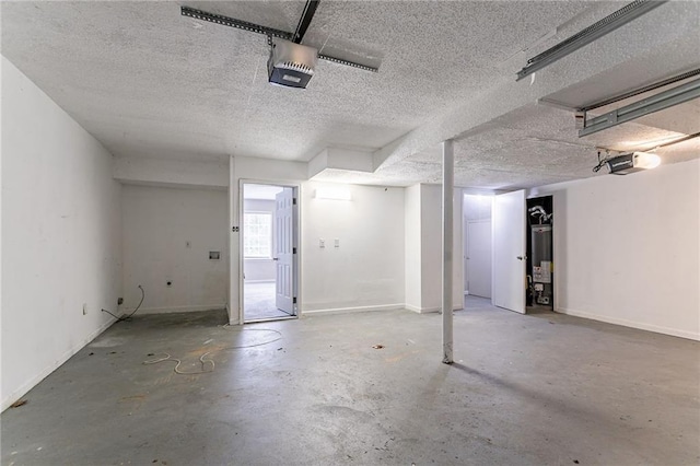 garage with water heater and a garage door opener