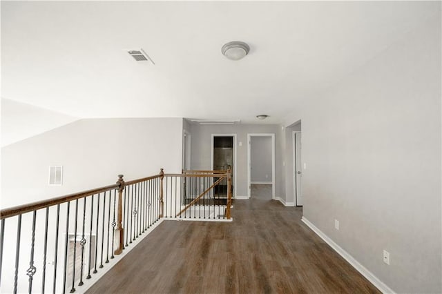 corridor featuring dark hardwood / wood-style floors