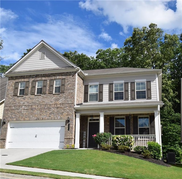 485 Broadmoor Dr, Braselton, GA 30517 - view of front of home featuring driveway, brick siding, a front lawn, a garage, and a porch