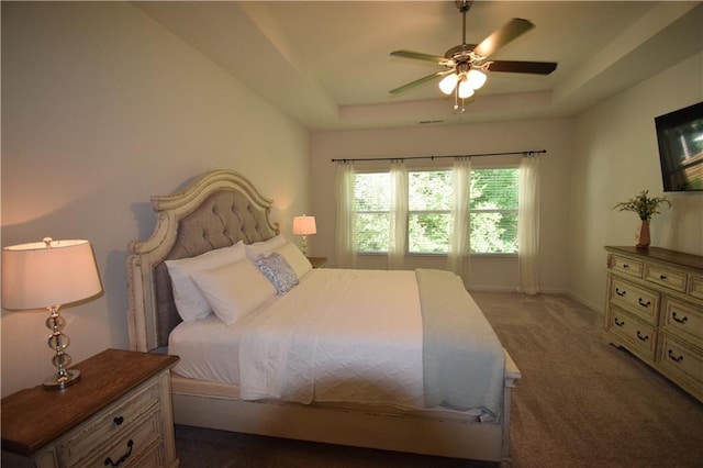 485 Broadmoor Dr, Braselton, GA 30517 - bedroom featuring a raised ceiling, dark carpet, ceiling fan, and baseboards