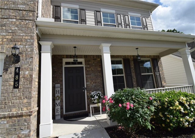 485 Broadmoor Dr, Braselton, GA 30517 - property entrance featuring a porch and brick siding