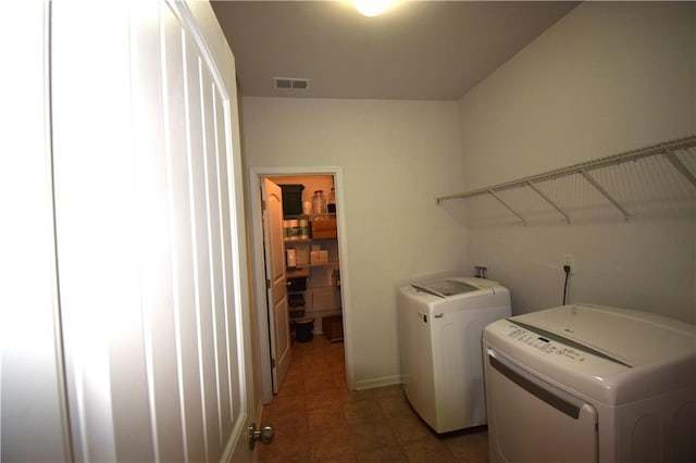 485 Broadmoor Dr, Braselton, GA 30517 - laundry room with washing machine and clothes dryer and tile patterned floors