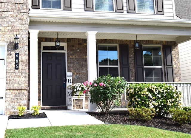 485 Broadmoor Dr, Braselton, GA 30517 - property entrance featuring covered porch and brick siding