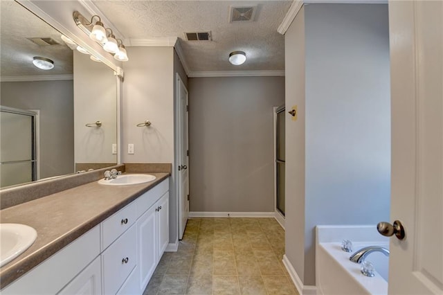 bathroom with a textured ceiling, ornamental molding, and a sink