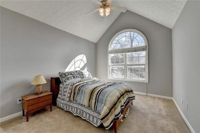 bedroom with a textured ceiling, a ceiling fan, baseboards, vaulted ceiling, and carpet