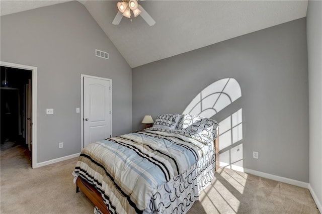 bedroom with high vaulted ceiling, visible vents, light carpet, and baseboards