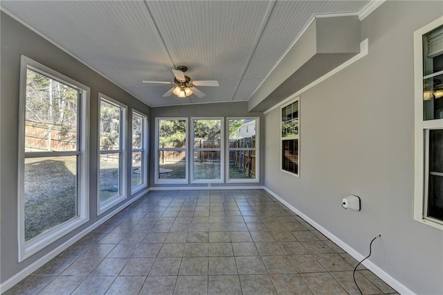 unfurnished sunroom with a ceiling fan