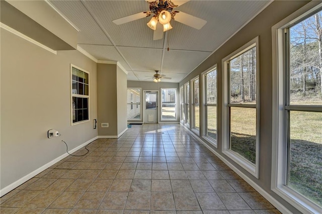 unfurnished sunroom featuring a wealth of natural light