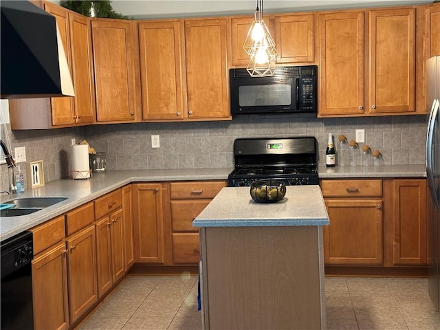 kitchen featuring black appliances, light tile patterned floors, a sink, and decorative light fixtures