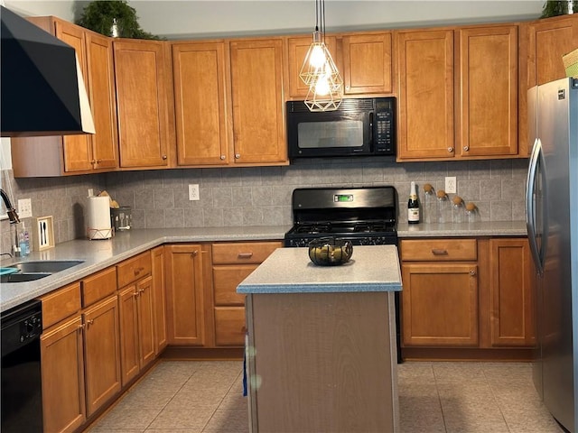 kitchen featuring black appliances, light countertops, a sink, and light tile patterned flooring