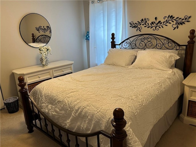 bedroom featuring light carpet