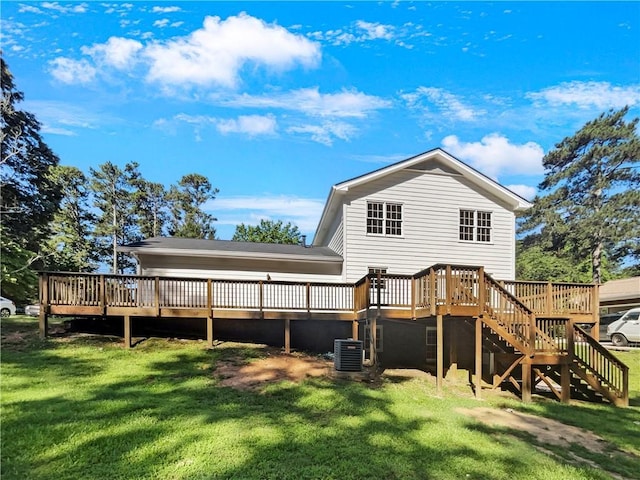 back of property featuring a yard, cooling unit, and a deck