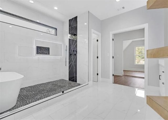 full bath with visible vents, marble finish floor, a marble finish shower, a soaking tub, and recessed lighting