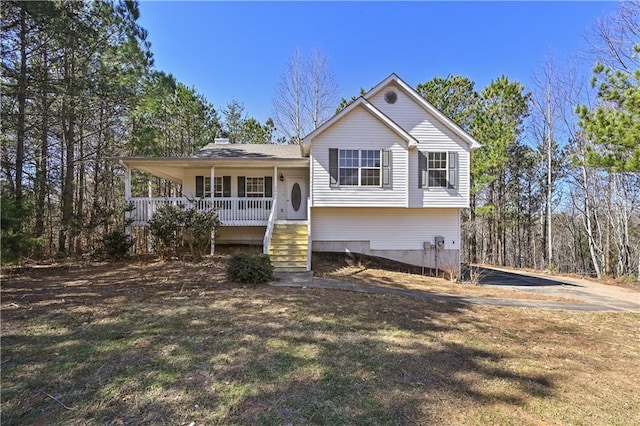 split level home with a porch and a front yard