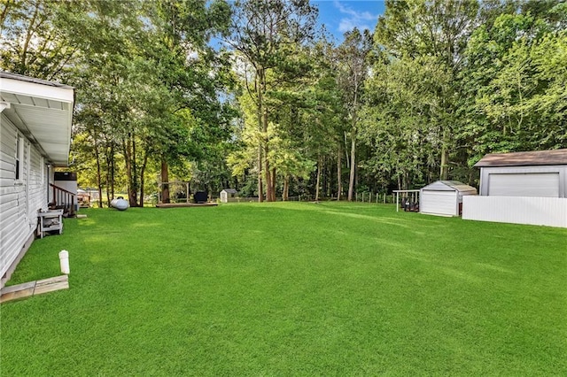 288 Valerie Cir, Hiram, GA 30141 - view of green lawn with view of wooded area and an outbuilding