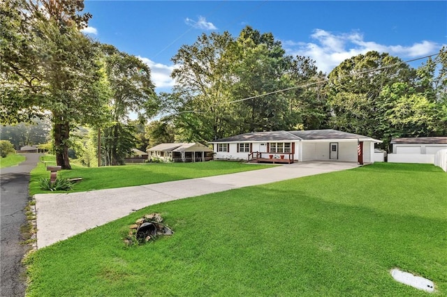 288 Valerie Cir, Hiram, GA 30141 - ranch-style house featuring a front yard, driveway, an attached carport, and view of scattered trees