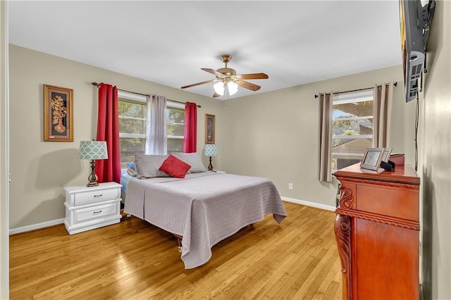 288 Valerie Cir, Hiram, GA 30141 - bedroom featuring light wood-style flooring, multiple windows, and ceiling fan