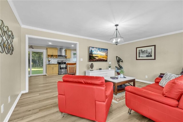 288 Valerie Cir, Hiram, GA 30141 - living area featuring light wood-style floors, ornamental molding, and a chandelier