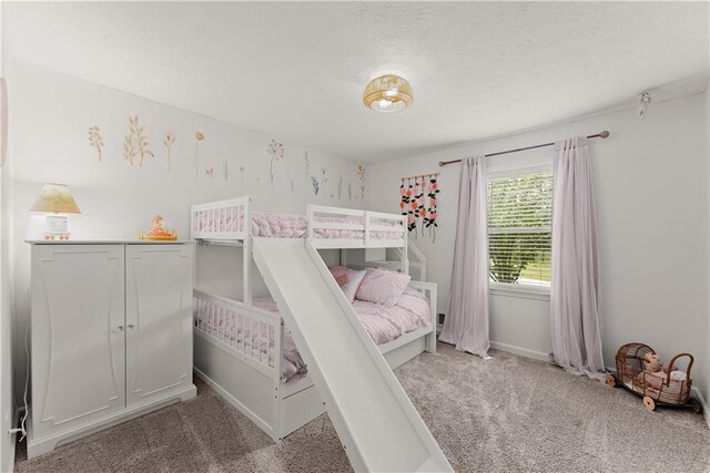 carpeted bedroom with baseboards