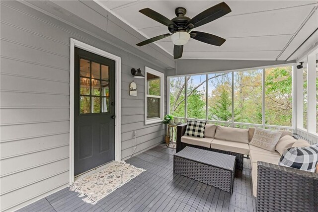sunroom / solarium with outdoor lounge area, a ceiling fan, and plenty of natural light