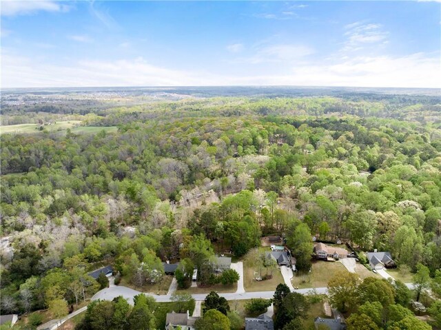 birds eye view of property with a forest view