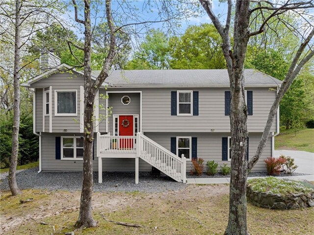 split foyer home featuring a chimney